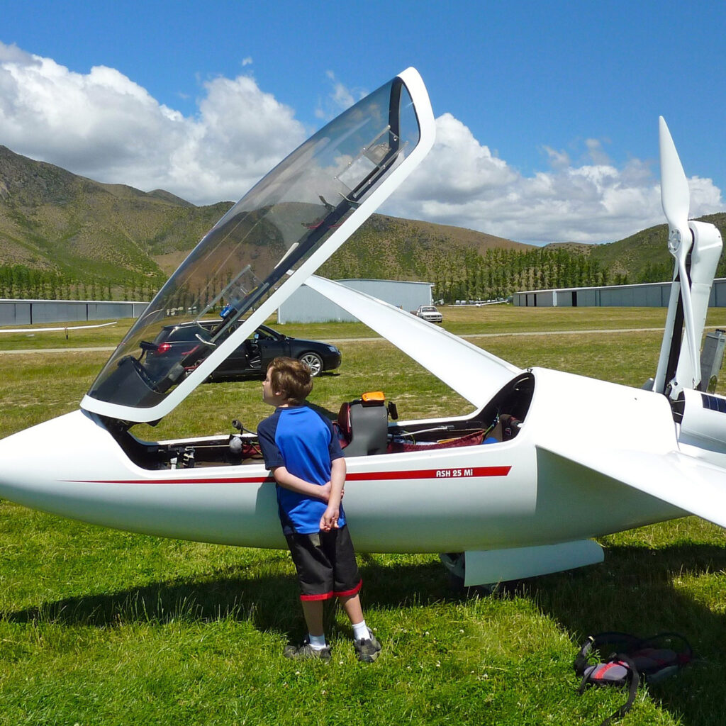 Young boy looking at glider